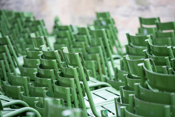 Blur of rows of multilevel empty green plastic seats