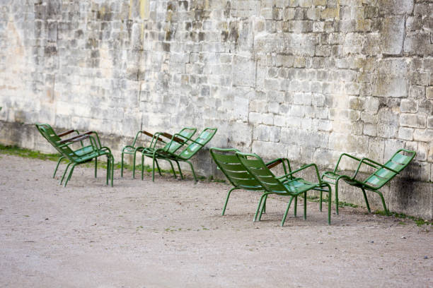 istock Tuileries Garden Paris in Winter with Stone Wall and Empty Chairs 1226799059