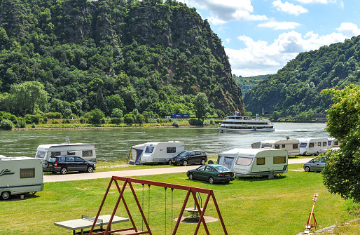 St. Goar, Germany, June 8, 2009 : Camping and trailer caravans beside the Rhine river at St.Goar in Germany.  The Rhine valley is a popular destination for visitors throughout the year.