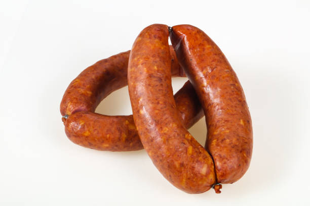 istock Tasty meat sausages over white background 1226802631