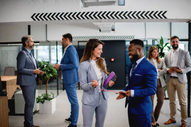 istock Business people with documents discussing new projects in office hall 1226803326