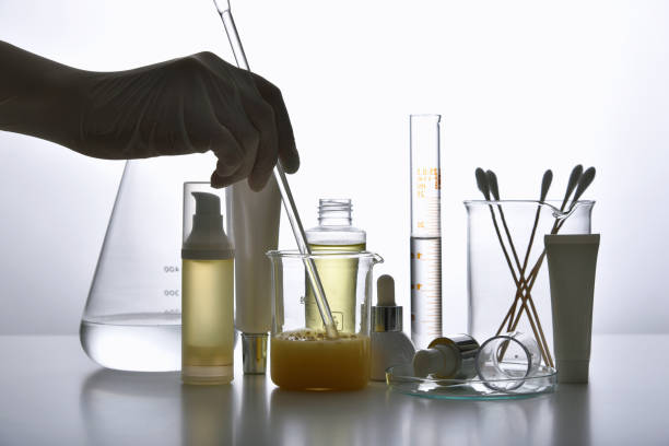 istock Dermatologist formulating and mixing pharmaceutical skincare, Cosmetic blank bottle containers and scientific glassware, Research and develop beauty product concept. 1226803327
