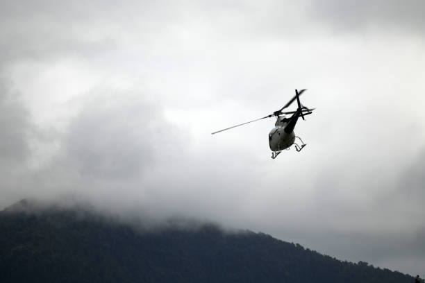 istock helicopter heading off to the hills 1226804094