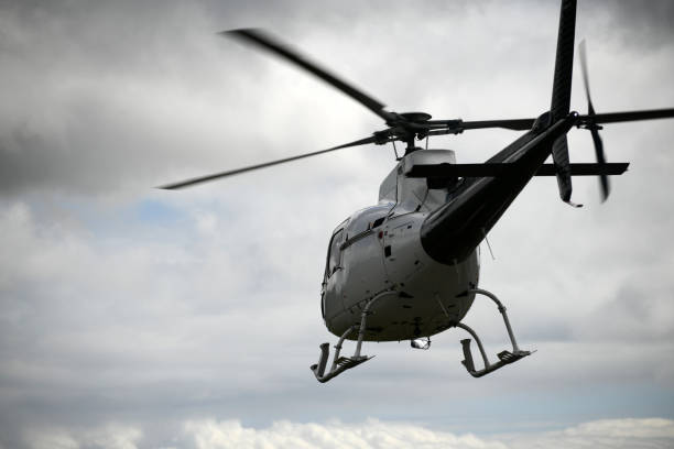 istock helicopter heading off to the hills 1226804100
