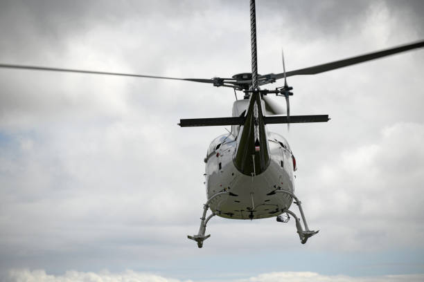 istock helicopter heading off to the hills 1226804101