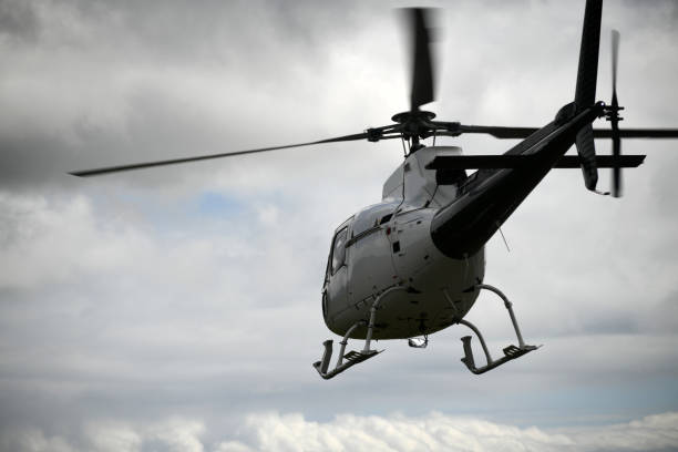 istock helicopter heading off to the hills 1226804107