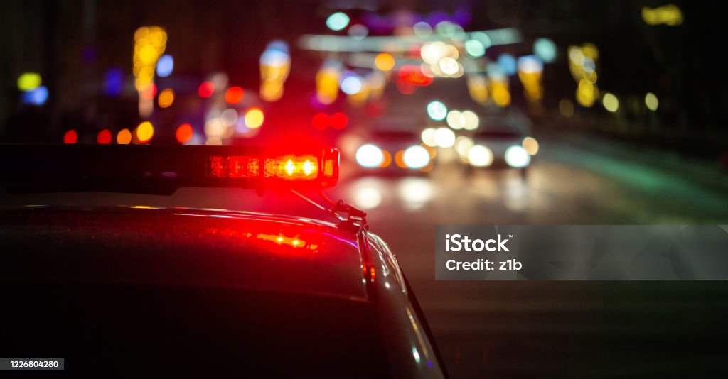 police car lights in night city with selective focus and bokeh police car lights at night in city with selective focus and bokeh background blur Drunk Driving Stock Photo