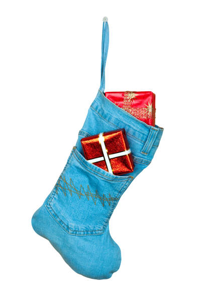 istock Blue denim Christmas boot with gifts on  isolated background 1226805079
