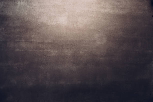 istock Dark brown concrete wall texture background in spot of light 1226805662