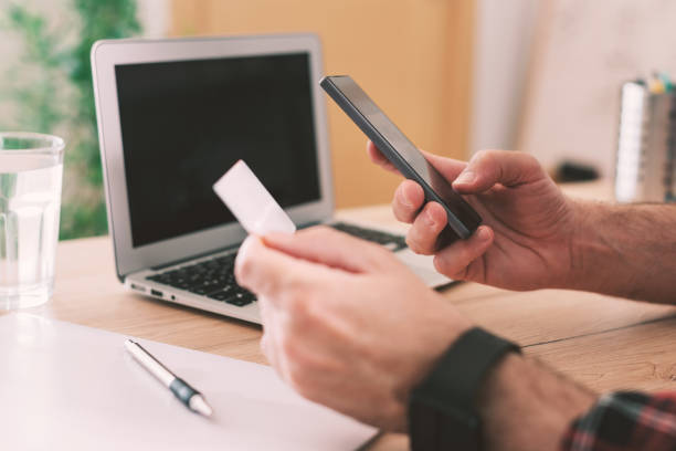 istock Online shopping from home office using smartphone and credit card 1226805742