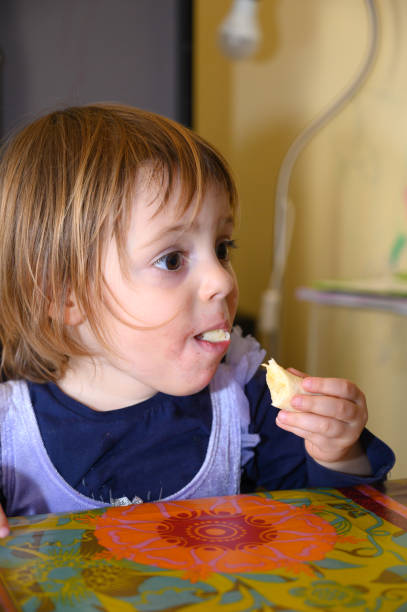 istock Girl eating banana 1226806676