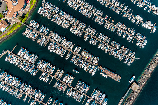A large group of boats moored at a Puget Sound marina just outside of Seattle, Washington shot from about 1000 feet directly overhead during a helicopter photo flight.