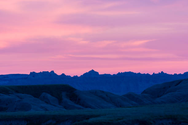 White clouds over the rock formations of the badlands