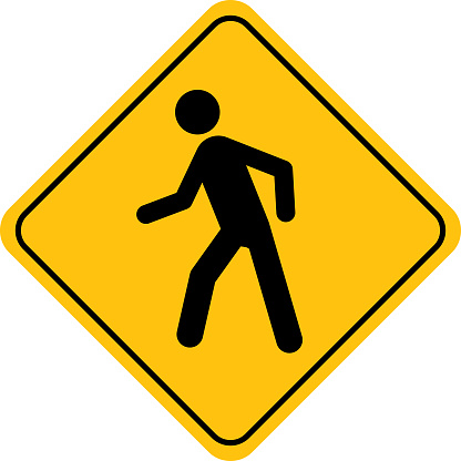 Vector illustration of a gold street sign with a black walking human figure on it.