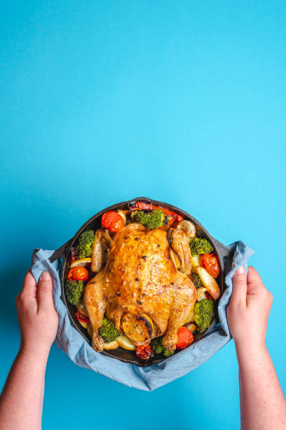 istock Chicken with vegetables baked in an iron cast. 1226810819