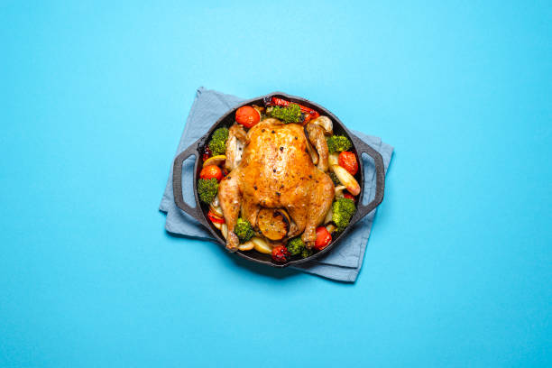 roasted chicken with vegetables in an iron cast, top view. - food prepared potato vegetable healthy eating imagens e fotografias de stock