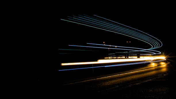 istock car lights at night on the road 1226814606