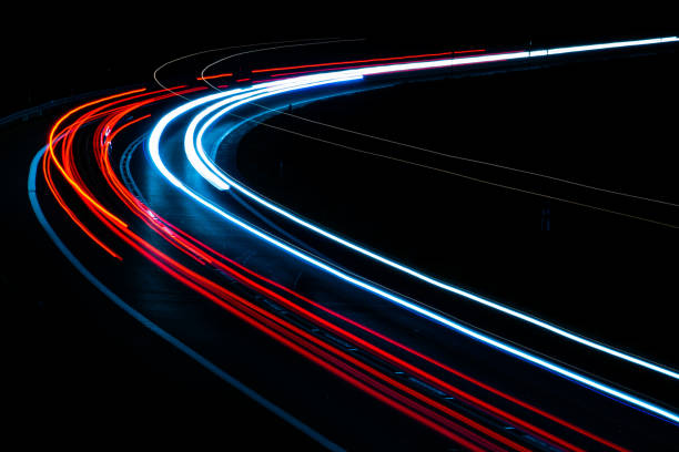 istock car lights at night on the road 1226814620