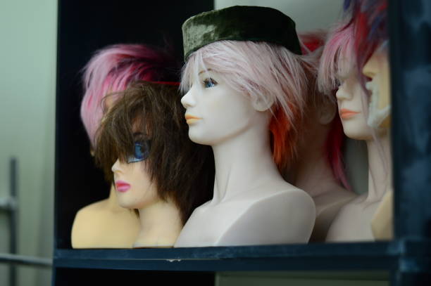 istock beautiful multi-colored wigs stand on a shelf 1226814936