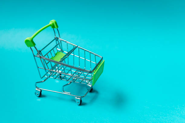 istock Shopping cart on blue background. E-commerce concept 1226815903