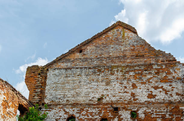 Old abandoned ruined building without a roof and windows.