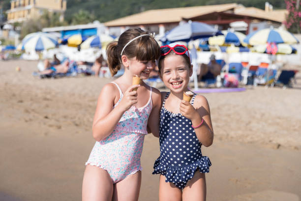 istock Happy girl hugging when having ice cream 1226817036