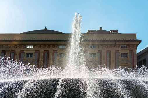 De Ferrari Square in Genoa, Italy: Fountain and pool at Ferrari Square square in Genoa, Italy. In the background, the Library of the Ligurian Society of Homeland History appears.