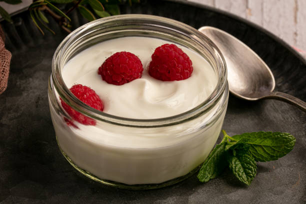 istock Yoghurt with raspberries on a metal plate 1226818747
