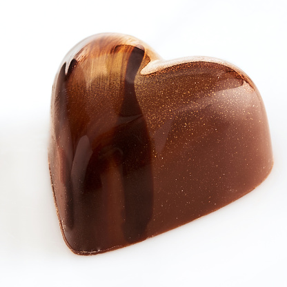 Isolated image of a heart shaped chocolate candy.