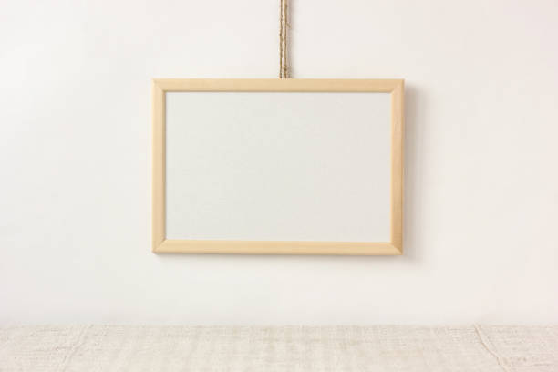 istock empty wooden frame with space for copying hangs above the table. 1226821759