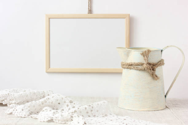 istock empty wooden frame with space to copy, pitcher and lace. mockup. 1226821774