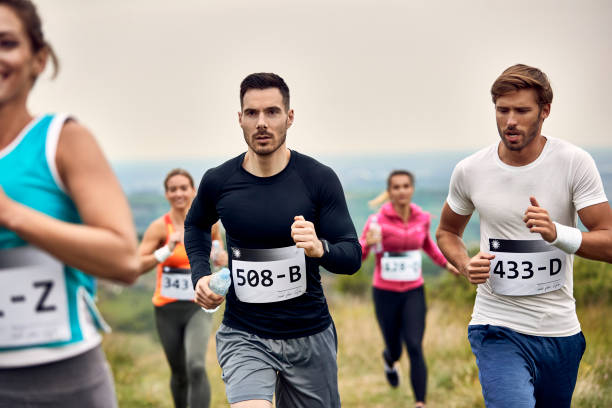 istock Group of athletic people running marathon in nature. 1226823200