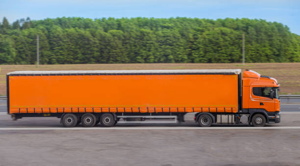 istock truck moving on a country road 1226831297