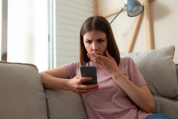 istock Female reading terrible news on her smartphone 1226831754