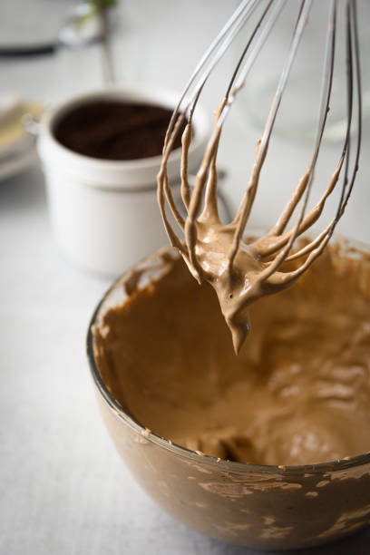 Dalgona coffee prepartion of fluffy whipped coffee with whisk