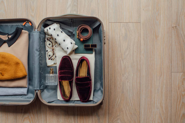istock Clothes and Stuff in an Open Suitcase on the Floor 1226832441