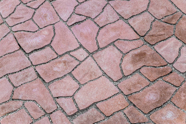 istock Pavement covering. Footpath paved with red tiled stone. Close-up. 1226833321