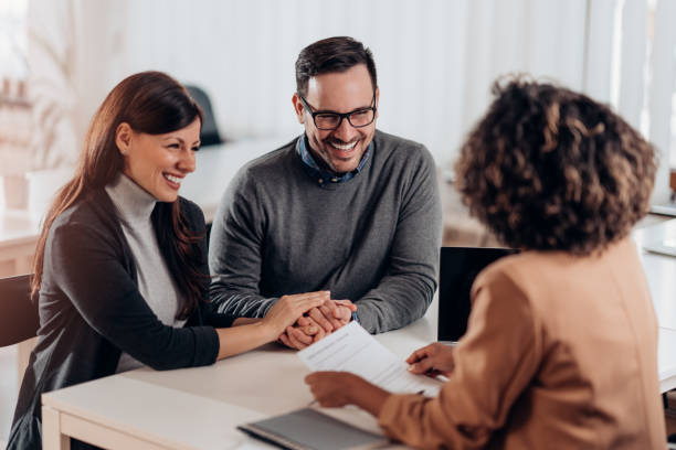 istock Couple talking to their insurance agent on a meeting 1226836779