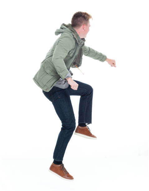 istock Caucasian boys jumping in front of white background wearing blazer 1226836873