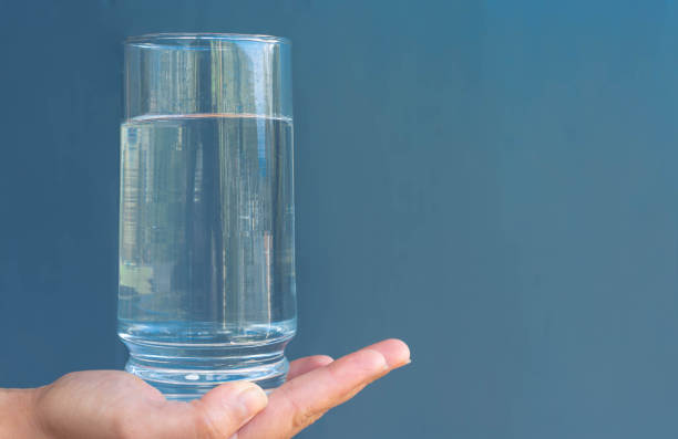 istock Glass of water with a blue copy space background. Hydration. 1226841518