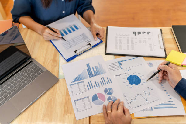 istock Financial auditor meeting analyzing a valuation of investment data. 1226841994