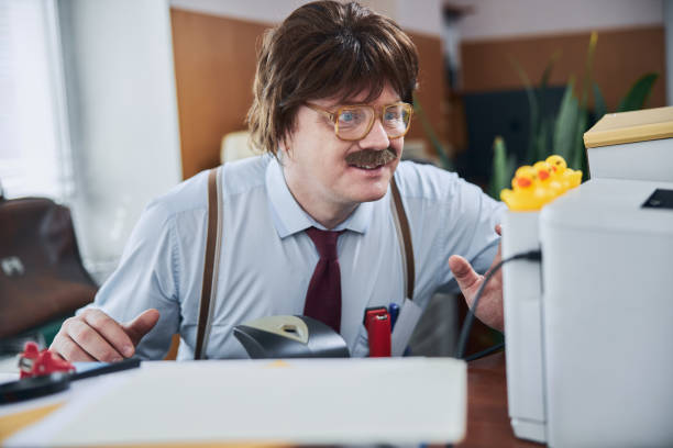 istock Excited financier looking at the rubber ducks on his scanner 1226843058