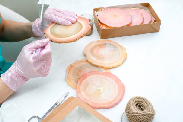 istock Creativity and craft. A young girl creates coasters from resin. Gift wrapping. Decorative packaging. Idea for business. Remote work, work at home. Art coasters. 1226844072