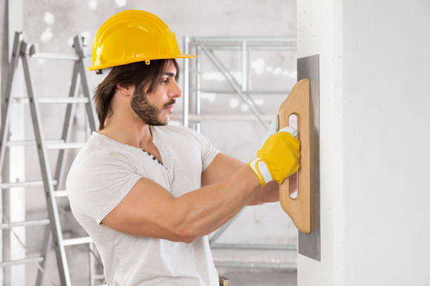 istock Plasterer finishing the surface of a white wall 1226844145