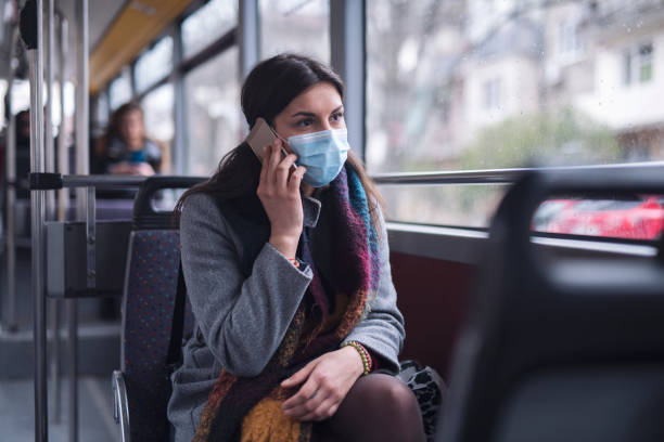 istock Woman With Protective Mask Talking On The Phone. 1226844759