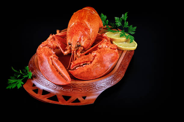 istock Cooked wild caught lobster with lemon on white plate. 1226845532