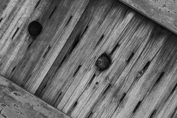 Closeup of wooden post and metal bands
