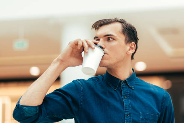 istock attractive young man with a coffee to take away 1226847989