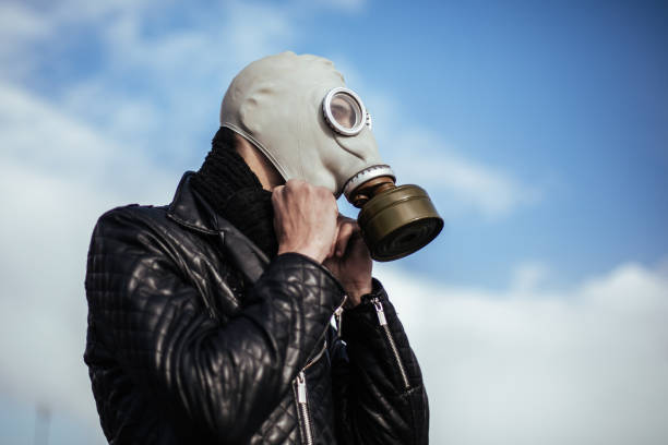 istock close up. casual guy in a gas mask 1226848549
