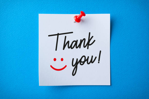 White Sticky Note With Thank You And Red Push Pin On Blue Background White Sticky Note With Thank You And Red Push Pin On Blue Background anthropomorphic smiley face photos stock pictures, royalty-free photos & images